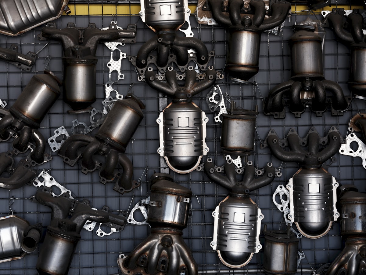 Rows of exhaust and catalytic converter units in a parts warehouse